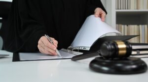 Cropped view of female lawyer working with contract or agreement